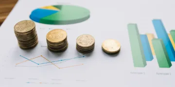 Moedas em cima de gráficos